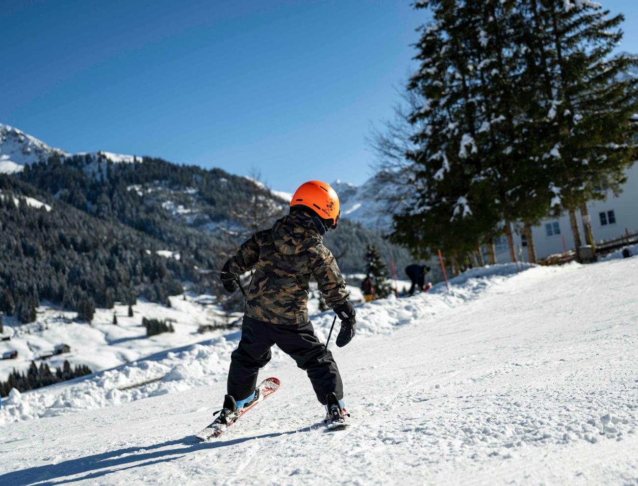 Child goes skiing in the Kleinwalsertal valley